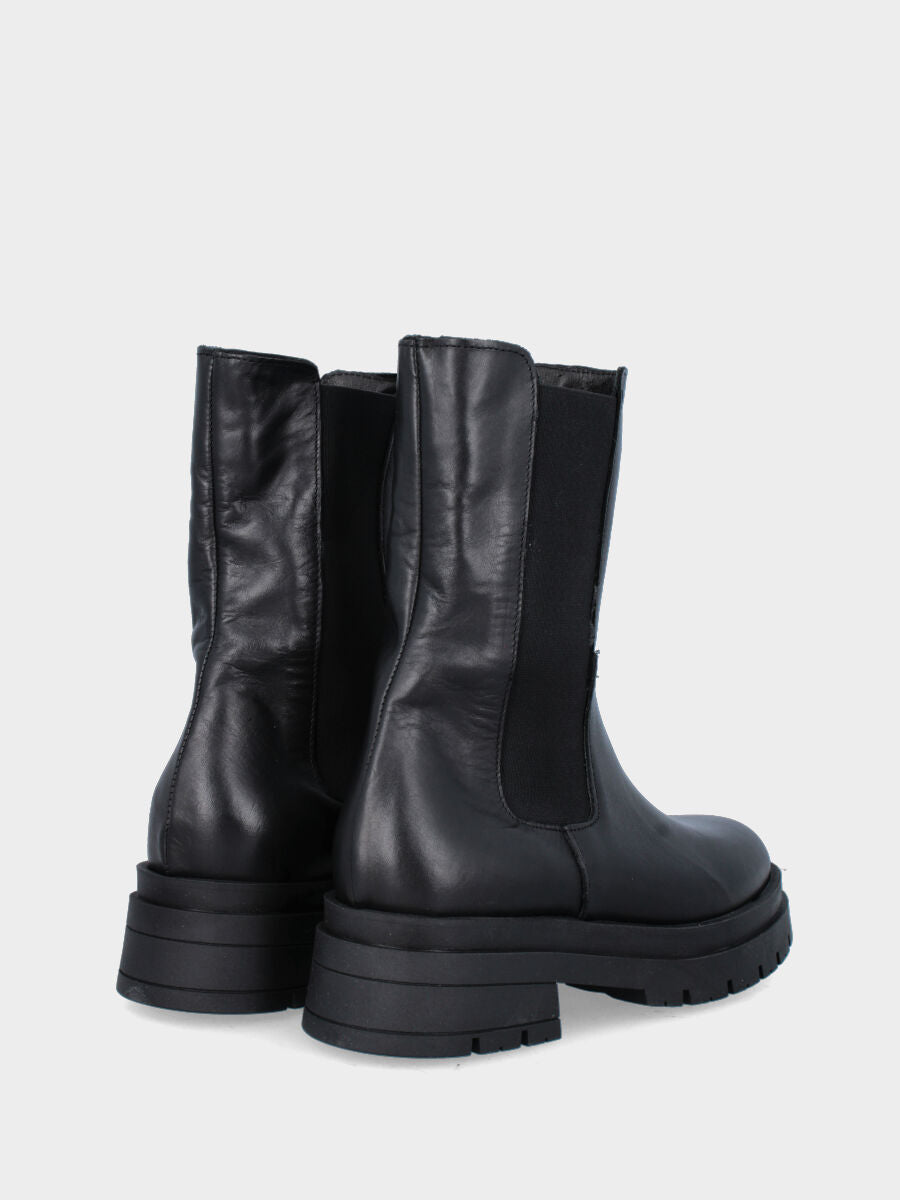 Boot de combat noir en cuir avec semelle crantée et bande élastique