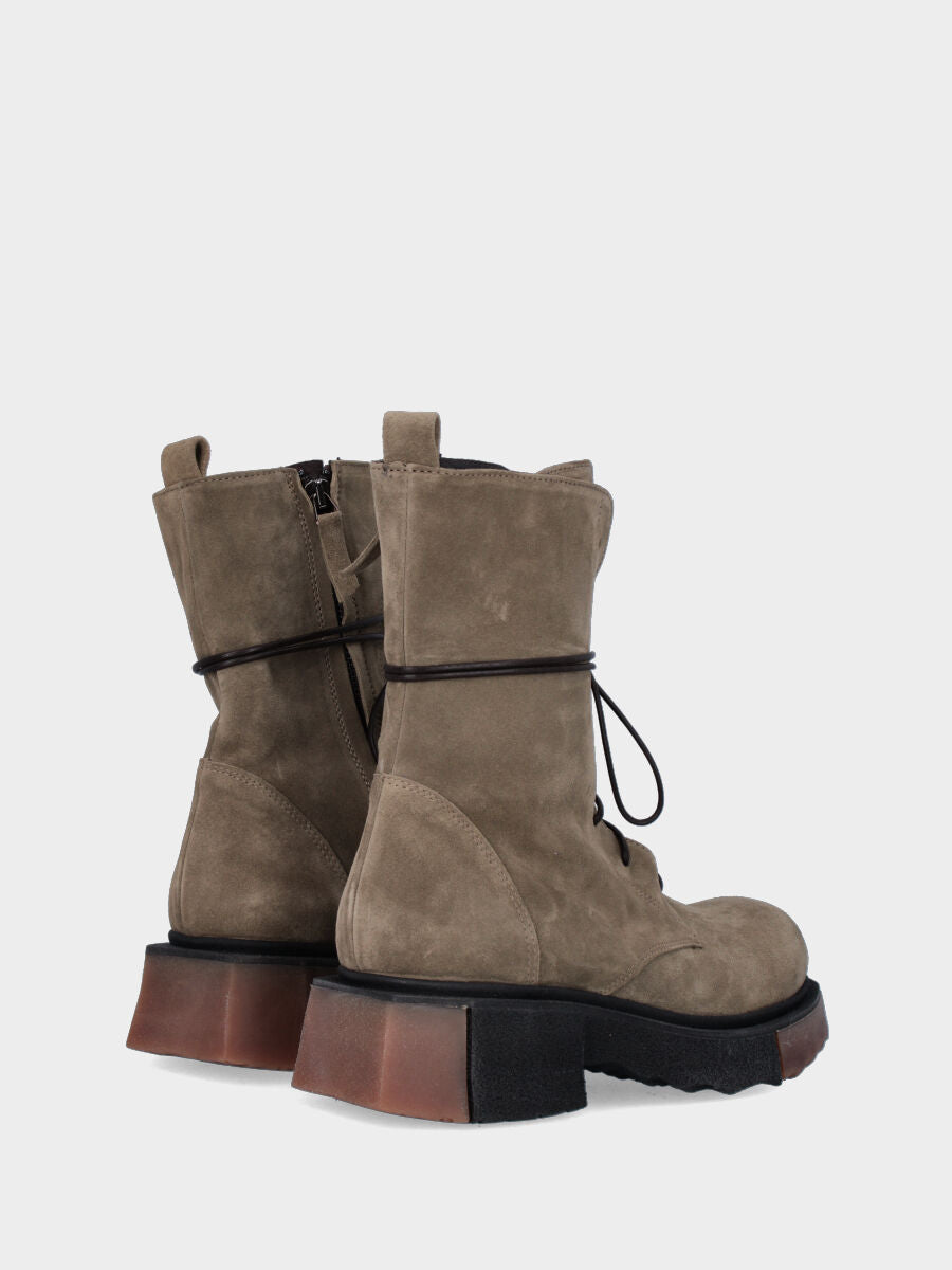 Green leather combat boot with two-tone sole