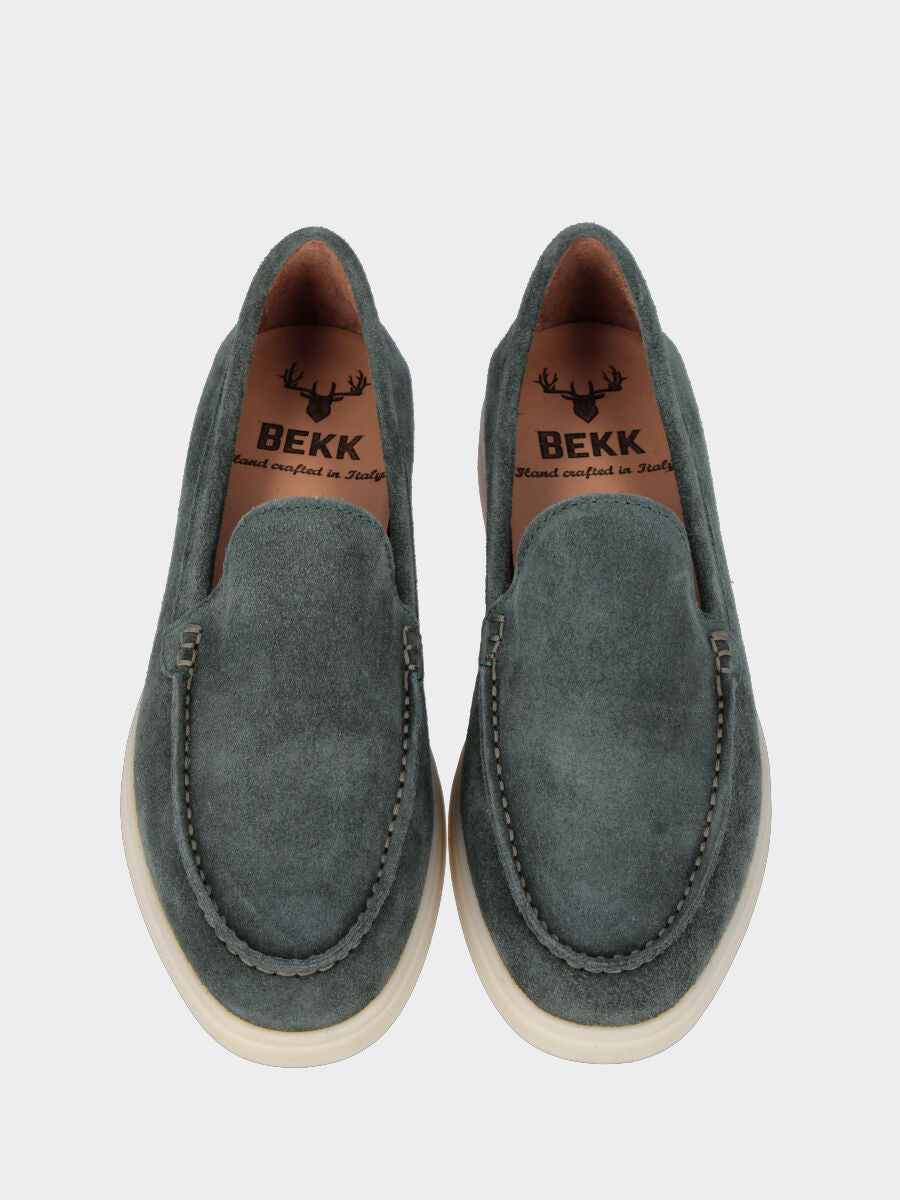 Forest green suede moccasin with stitched tray joint to the upper