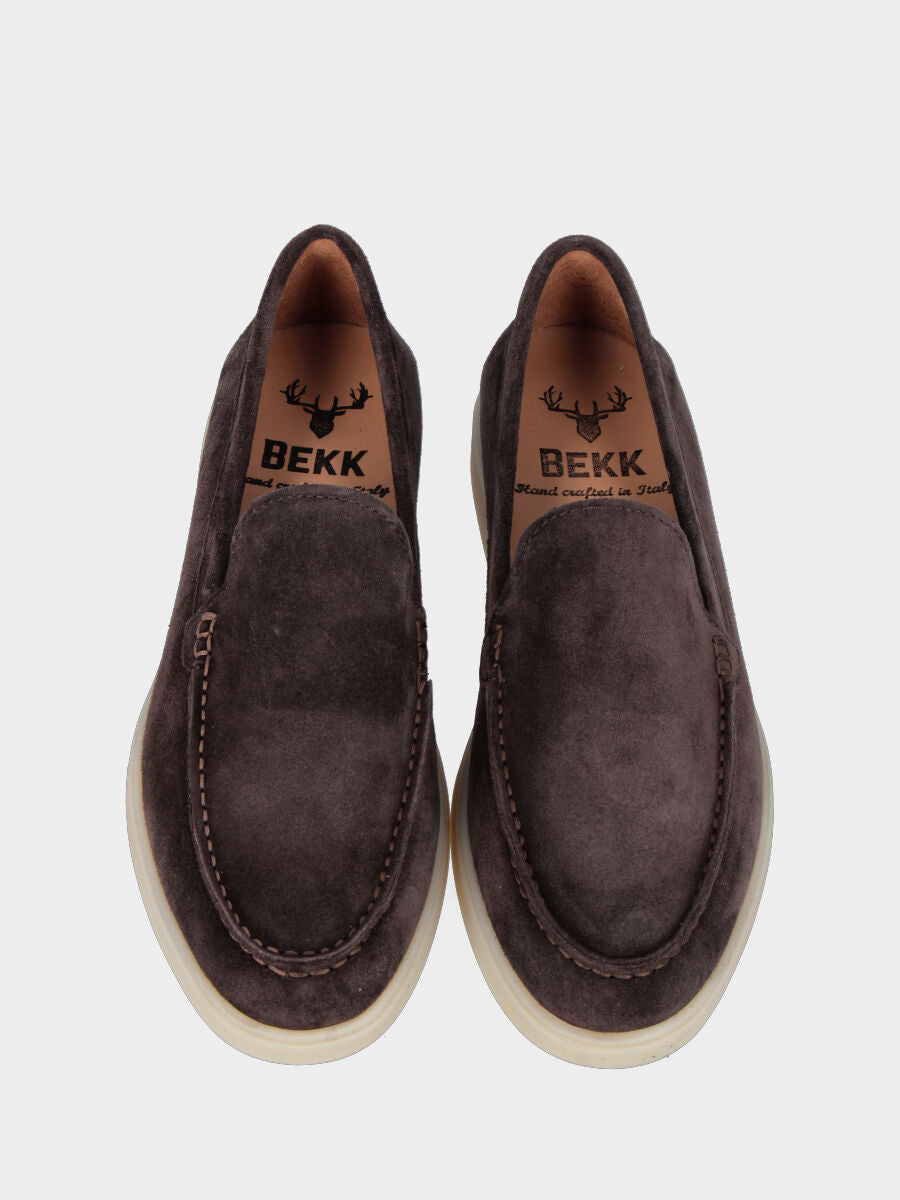 Dark brown suede moccasin with stitched cup sole attached to the upper