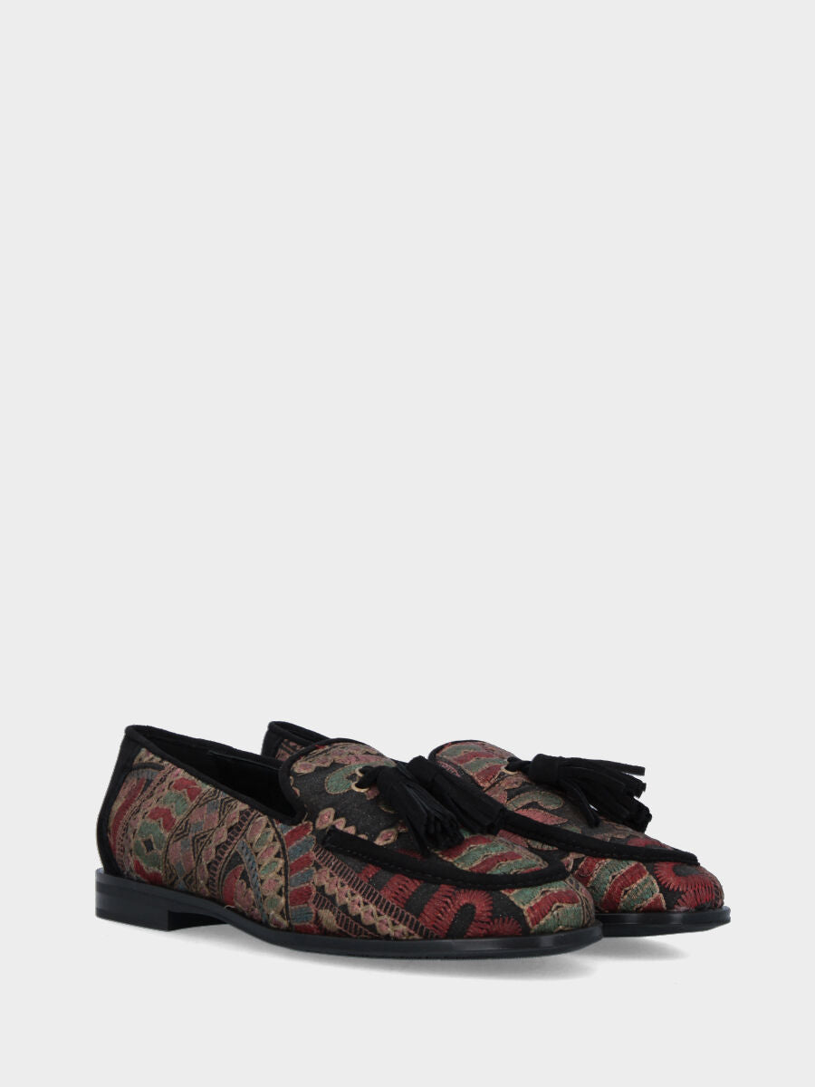 Mocassin en tissu ethnique avec pompons et finitions en suède