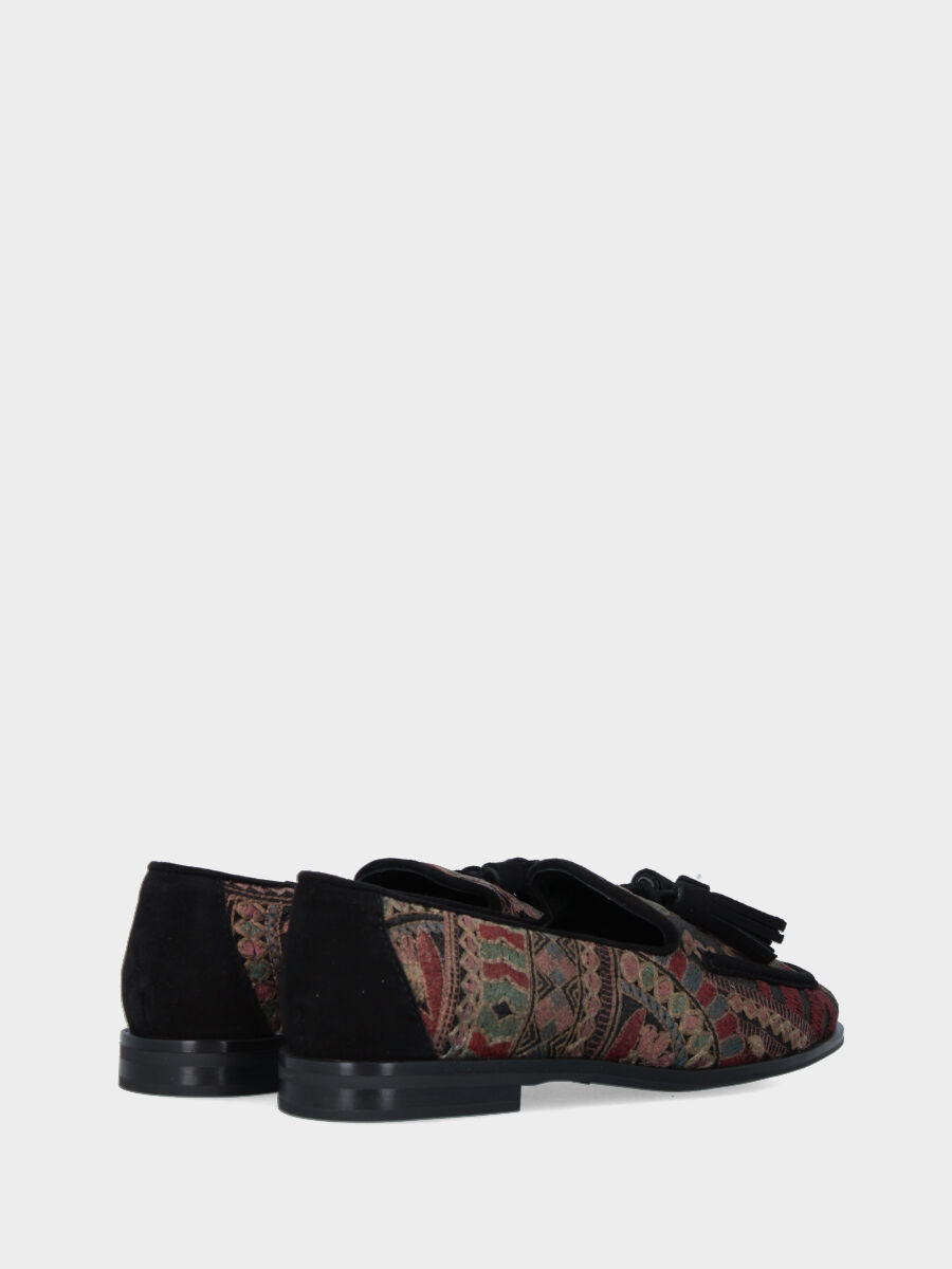 Mocassin en tissu ethnique avec pompons et finitions en suède
