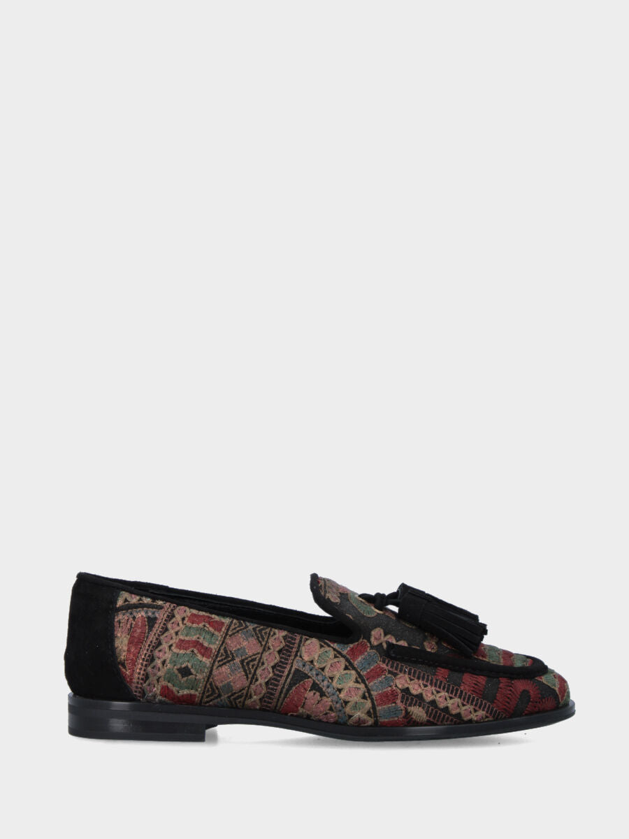 Mocassin en tissu ethnique avec pompons et finitions en suède