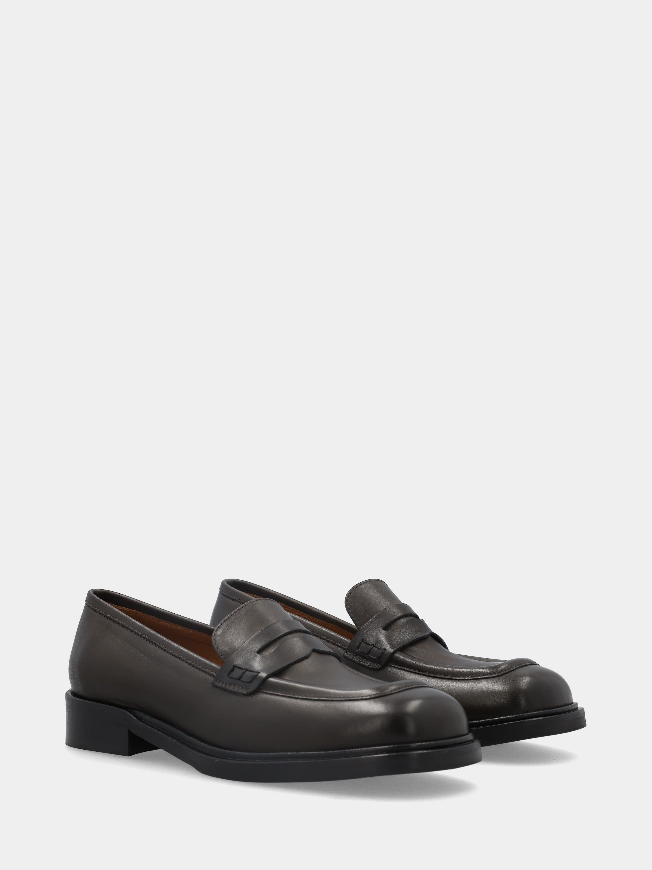 Calfskin moccasin in dark brown with lion mouth mask