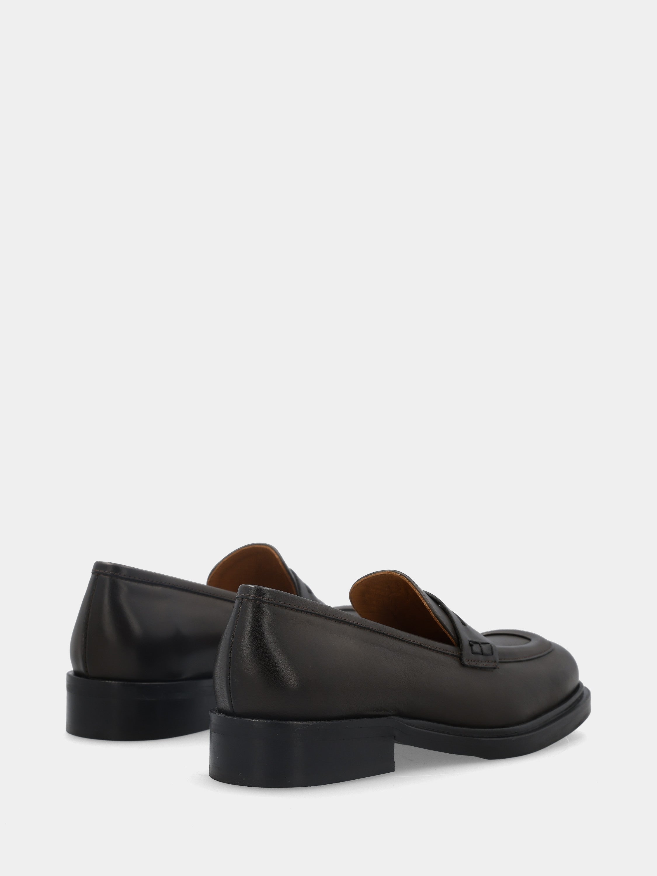 Calfskin moccasin in dark brown with lion mouth mask
