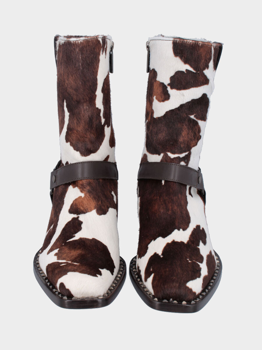 Bottines western en cuir façon poulain moucheté avec clous et étrier