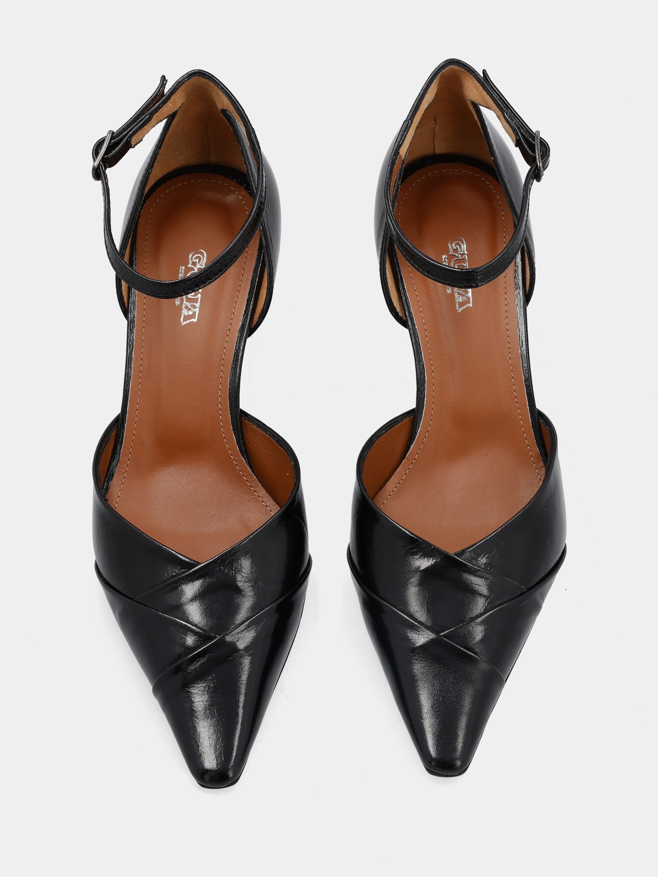 Black calfskin pumps with strap and hollow heel
