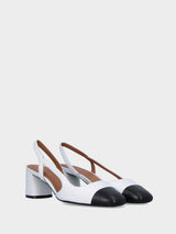 Slingback in vitello bicolore bianco e nero con scollo asimmetrico
