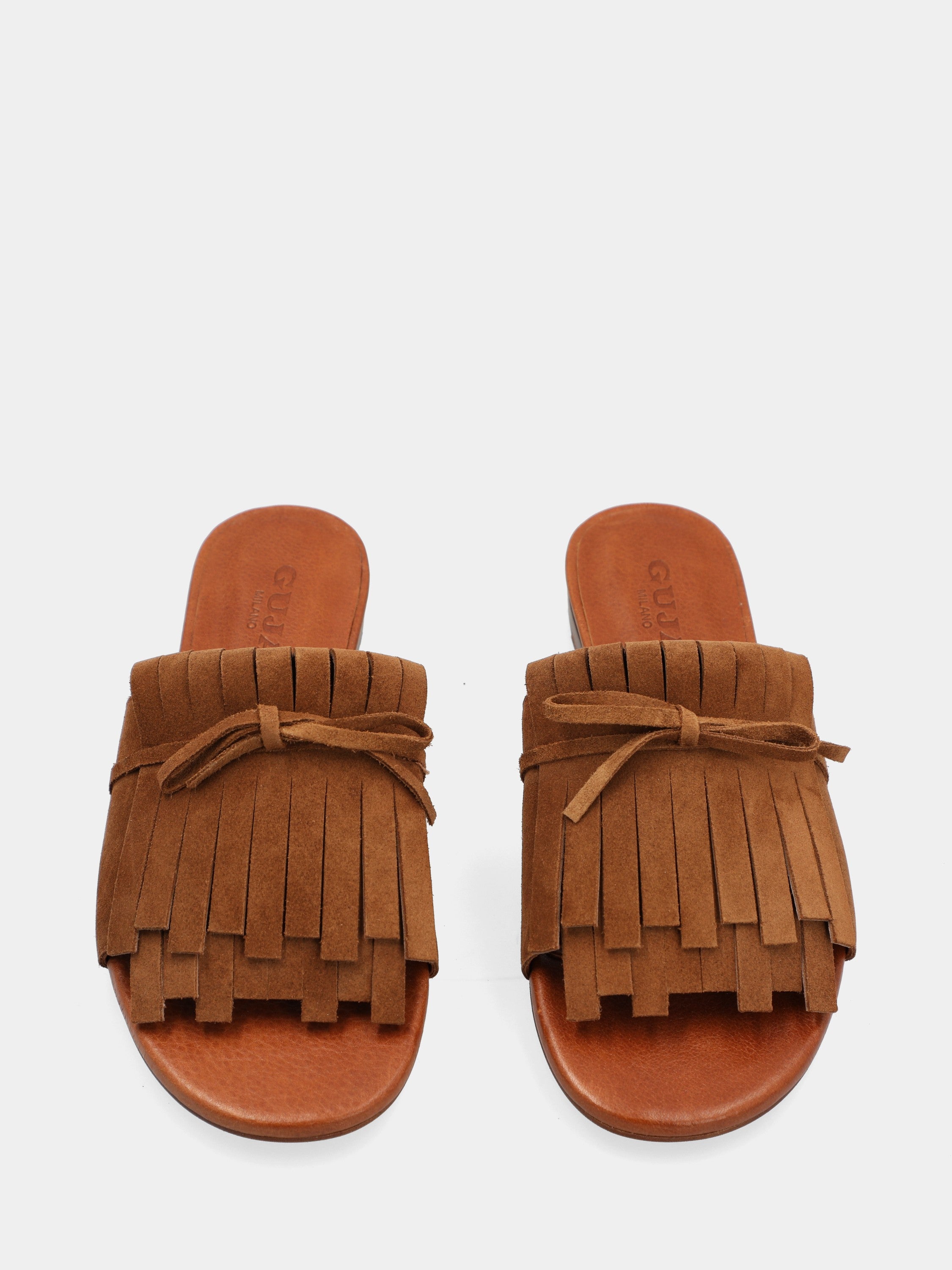 Mule en suède couleur cuir avec plateforme compensée et double frange