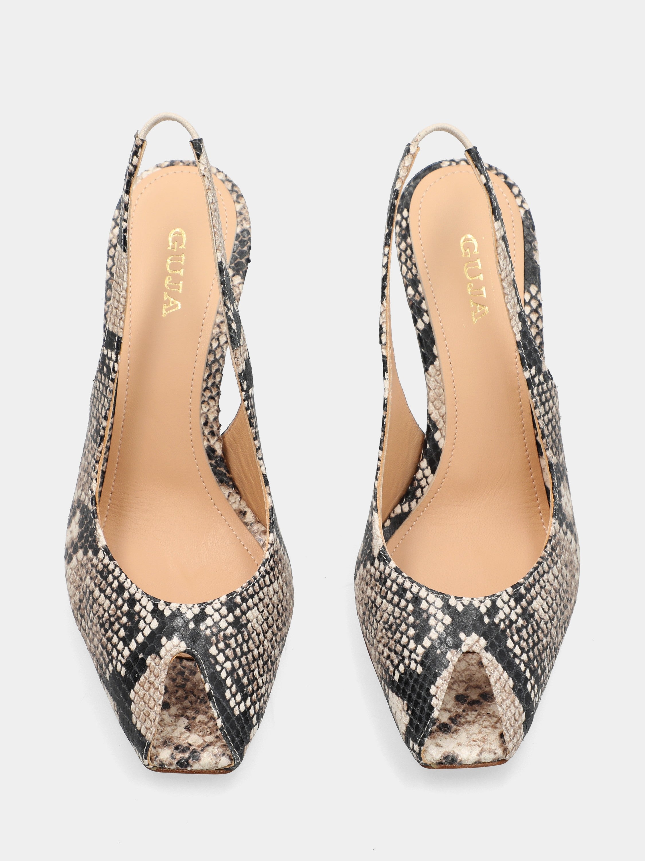 Slingback in vitello pitonato con tacco incavato a coda