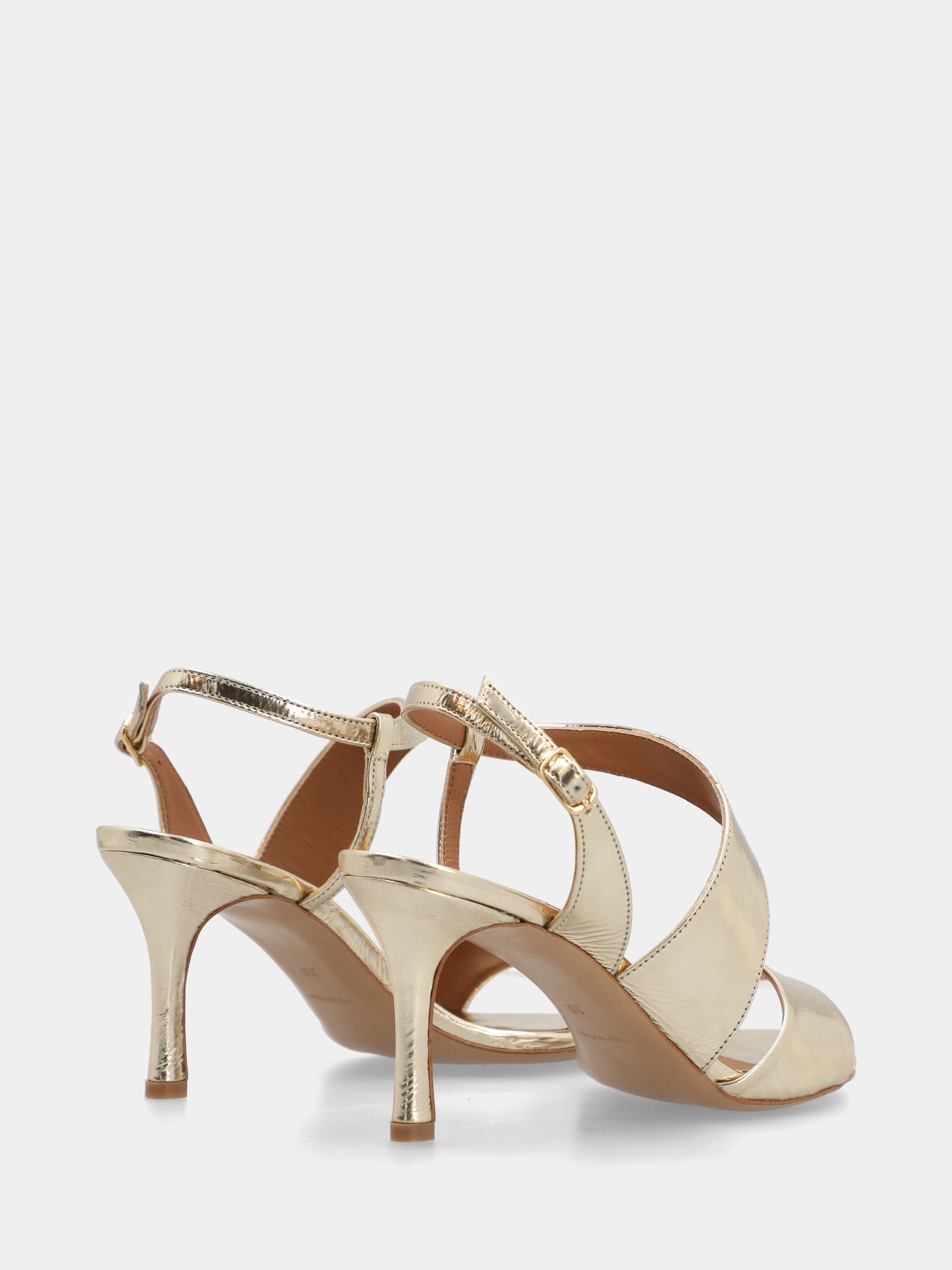 Platinum laminated sandal with asymmetric straps and round toe
