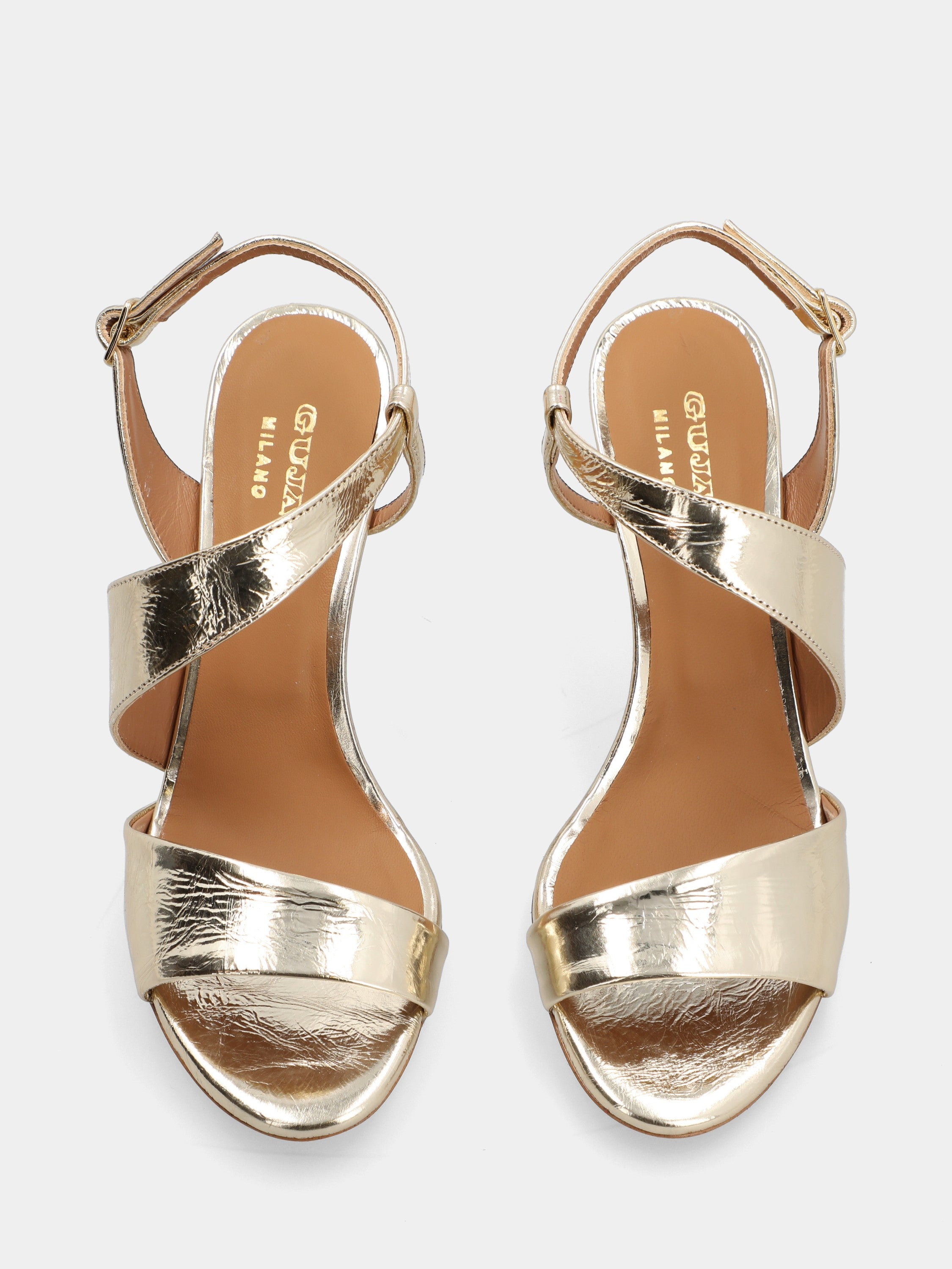 Platinum laminated sandal with asymmetric straps and round toe