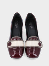 Pantofolina rossa in pelle con profili a contrasto e bottone